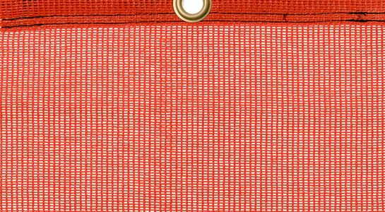 Detail picture of PE air permeable cover, orange, with eyelet and border on top